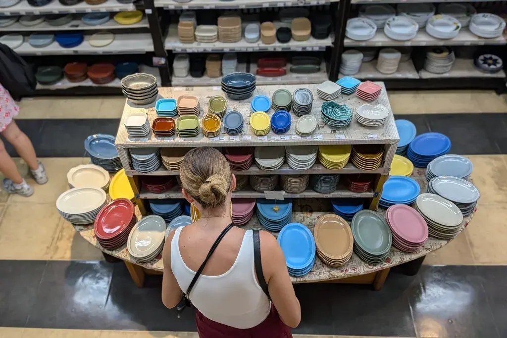 A guest browsing ceramic bowls