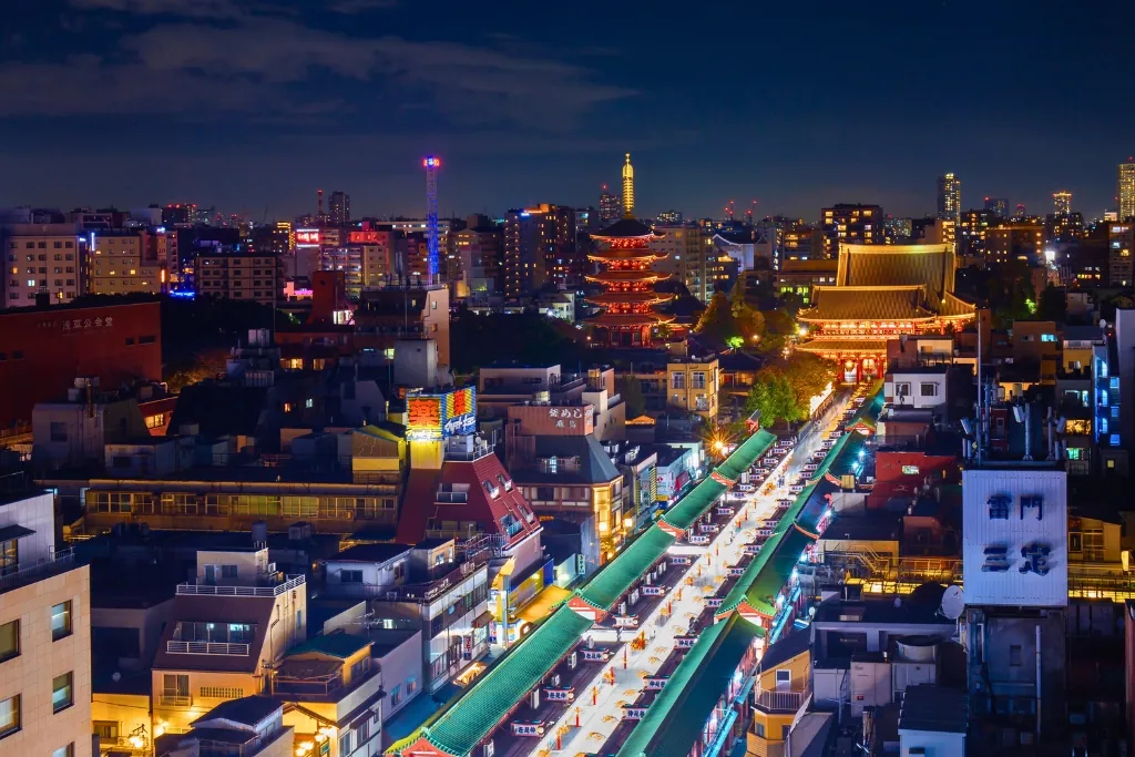 Asakusa at night from above, with the five-story pagoda and Nakamise lit up