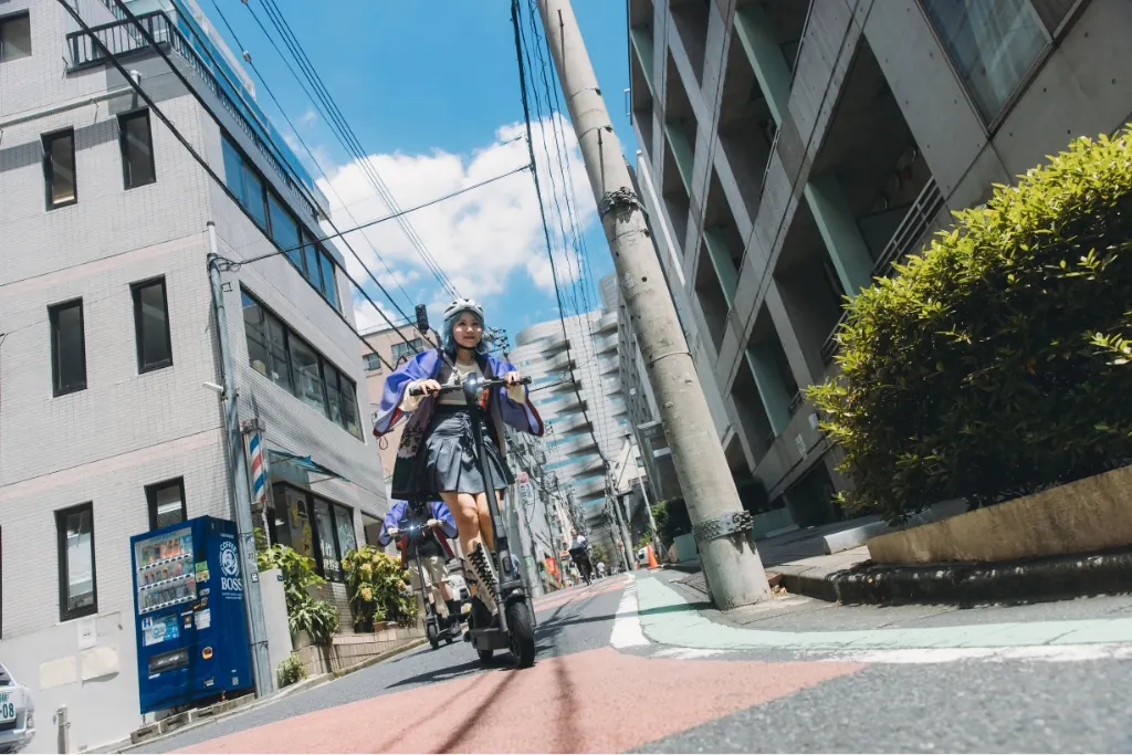 Riding an e-scooter through Shinjuku by day